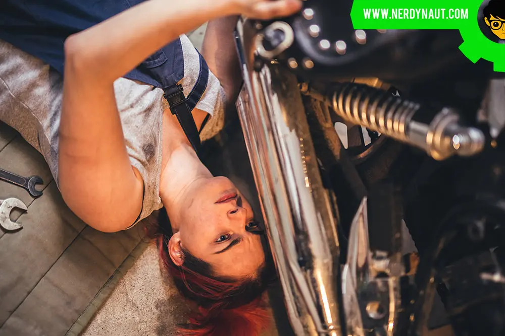 Girl repairing a car