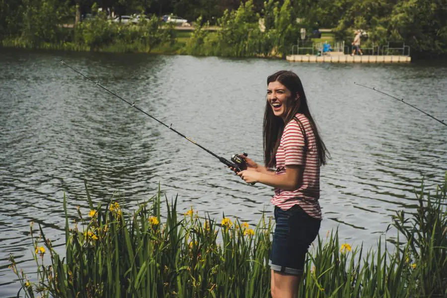 Woman fishing on a lake