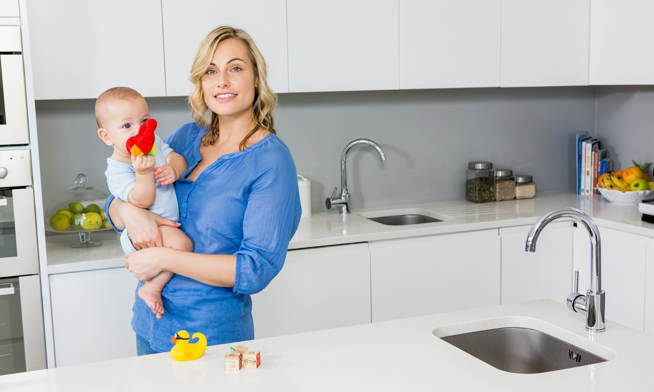 Mother with a baby at Kitchen