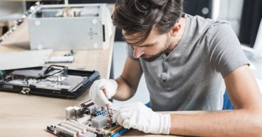 computer business by a male computer repairer