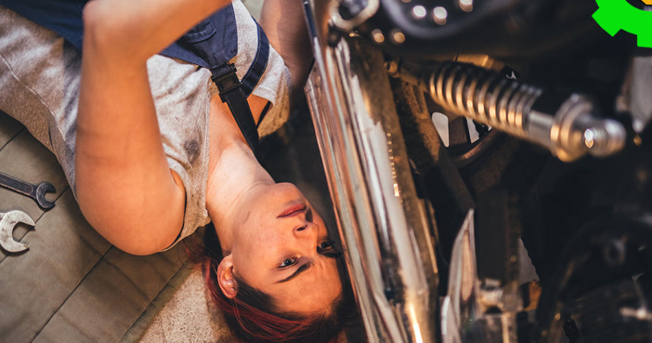 Girl repairing a car