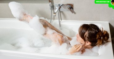 woman having a bath in a bathtub